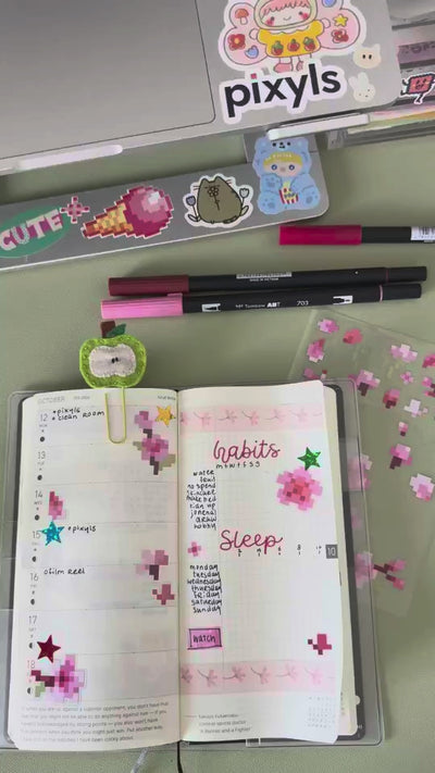 Pixyls sticker sheets in a journal